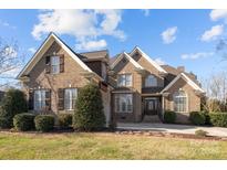 Brick two-story house with a large front yard and stone pathway at 3417 Millstone Creek Rd, Lancaster, SC 29720