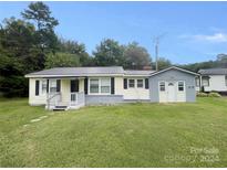 Ranch style home with gray and white exterior, small front porch, and yard at 3630 Old Mocksville Rd, Salisbury, NC 28144