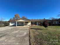 Ranch style home with attached garage and carport at 7855 Nc Highway 90 E E None, Stony Point, NC 28678