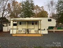 Spacious RV with covered porch and parking area at 204 Lake Tillery Trl, Mount Gilead, NC 27306