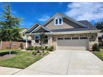 Suburban ranch home with two-car garage and landscaped front yard at 3516 Marchers Trace Dr, Mint Hill, NC 28227