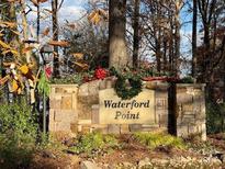 Waterford Point community entrance, stone signage with festive holiday decor at 21315 Blakely Shores Dr, Cornelius, NC 28031