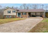 Brick ranch home with covered patio and carport at 3842 22Nd Street Ne Ct, Hickory, NC 28601