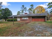 Brick ranch house with attached garage and a large yard at 4620 Sherrills Ford Rd, Salisbury, NC 28147