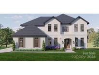 Two-story home with white brick, dark gray roof, and landscaping at 0 S Potter Rd # 1A, Waxhaw, NC 28173