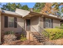 Tan exterior house with dark brown door and landscaping at 924 Cranberry Cir # 50-C, Fort Mill, SC 29715