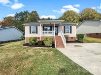 Ranch style home with brick accents, steps and landscaping at 236 Kimball St, Kannapolis, NC 28081