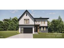 Two-story modern home with white brick and black accents at 154A Lookout Dam Rd, Statesville, NC 28625