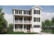 Two-story home with white siding, dark green windows, and a balcony at 155A Lookout Dam Rd, Statesville, NC 28625