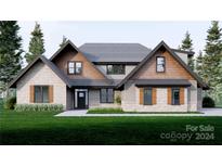 Two-story craftsman style home with stone and wood siding, and a landscaped lawn at 156A Lookout Dam Rd, Statesville, NC 28625