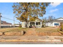 Charming light green house with a wrap-around porch at 301 Wilson N St, Rock Hill, SC 29730