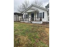 White house with front porch and yard at 843 Spring St, Rock Hill, SC 29730