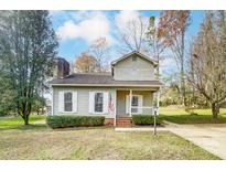 Charming one-story house with a spacious yard and driveway at 3040 Wagonwheel Ct, Belmont, NC 28012