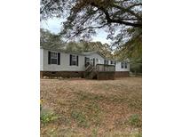 Single-wide mobile home with deck and large yard at 6957 Ray Linker Rd, Concord, NC 28025