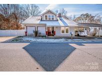 Charming house with a snow-covered roof and carport at 241 4Th N Ave, Taylorsville, NC 28681