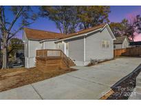 Newly built home with a deck and driveway at 287 Young Sw Ave, Concord, NC 28025