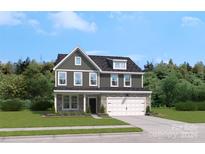 Two-story home with gray siding, white trim, and a two-car garage at 208 Coronado Ave # 47, Matthews, NC 28104