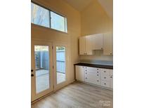 Bright kitchen with granite countertops and white cabinets at 6130 Heathstone Ln, Charlotte, NC 28210