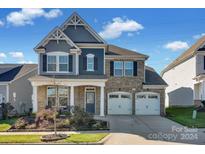 Charming two-story home with a welcoming front porch and attached two-car garage at 3611 Antrim Pl, Kannapolis, NC 28081