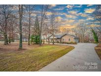 Charming two-story home with a paved driveway and surrounding trees at 1115 Stony Point Rd, Kings Mountain, NC 28086