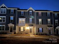 Charming townhome with inviting front entrance and landscaping at 2133 Tupelo Grove Ln, Gastonia, NC 28054