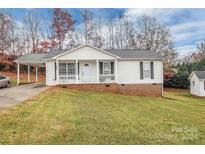 Ranch style house with carport and landscaped lawn at 126 Mill Creek Dr, Kings Mountain, NC 28086