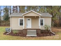 Cute cottage with front porch and landscaping at 1555 Sam Smith Rd, Fort Mill, SC 29708