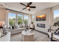 Spacious living room featuring a fireplace and large windows at 207 Tamala St, Davidson, NC 28036