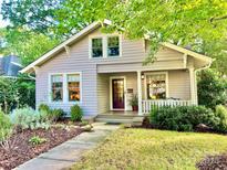 Charming craftsman home with a spacious front yard and well-manicured landscaping at 2129 E 8Th St, Charlotte, NC 28204