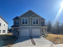 Newly constructed duplex boasts modern design, two-car garages, and appealing curb appeal at 630 Smith St # B, Mooresville, NC 28115