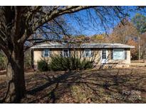 Tan ranch house with multiple windows and a front door at 1022 Harper Keefe Rd, Indian Land, SC 29707