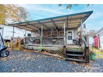 Charming cottage with a covered porch and spacious deck at 108 Fathom Trl # 178, Mount Gilead, NC 27306