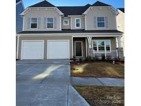 Two-story house with neutral siding, two-car garage, and a small front yard at 18024 Wilbanks Dr, Charlotte, NC 28278