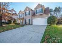 Two story house with attached garage and landscaping at 2299 Elendil Ln, Charlotte, NC 28269