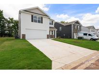 Two-story house with white siding, a brown door, and a two-car garage at 1009 20Th Avenue Se Loop, Hickory, NC 28602