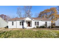 Charming ranch home with a freshly painted exterior and well-maintained lawn at 2301 Heather Glen Ln, Charlotte, NC 28208