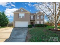 Two-story house with attached garage and spacious yard at 1114 Fenwick Ct, Clover, SC 29710