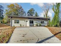 Charming craftsman style home with a concrete driveway at 1410 Deborah Cir, Shelby, NC 28150