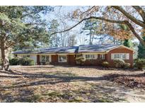 Brick ranch house with mature trees and a large yard at 829 Rawlinson Rd, Rock Hill, SC 29732