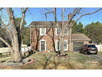 Charming two-story brick home with attached garage and fenced yard at 7618 Coffey Creek Dr, Charlotte, NC 28273