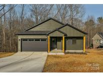 Craftsman style home with gray siding, and a two-car garage at 3433 Leaning Pine Dr, Lincolnton, NC 28092