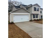 Two-story home with a two-car garage and a large driveway at 1305 Dodd St, Shelby, NC 28152
