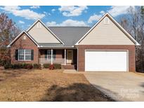 Brick ranch house with attached garage and front porch at 2053 Boxcar Rd, Lancaster, SC 29720