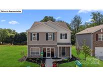 Charming two-story home with a landscaped front yard at 12157 Lady Bell Dr, Charlotte, NC 28278
