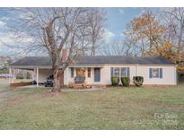 Charming one-story home with a carport, front porch, and large front yard at 2351 Walker Rd, Mount Pleasant, NC 28124