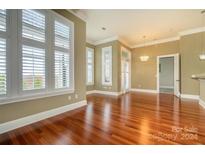 Bright dining room with hardwood floors and plantation shutters at 2810 Selwyn Ave # 418, Charlotte, NC 28209