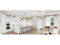Modern white kitchen with island, stainless steel appliances, and ample cabinet space at 4941 Marina Dr # 199, Sherrills Ford, NC 28673