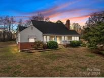 Charming ranch home with brick accents and a spacious yard at 945 Potneck Rd, Salisbury, NC 28147