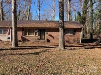 Brick ranch house with mature trees and a large yard at 612 Summerow Rd # 22, Stanley, NC 28164