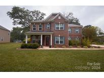 Brick two-story house with landscaping and a red door at 1735 Herndon Farm Rd, Rock Hill, SC 29732